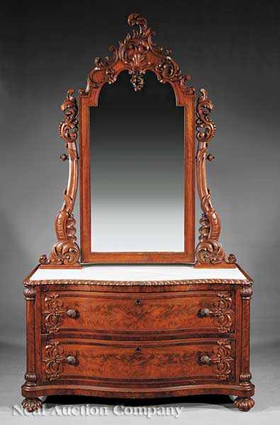 Appraisal: An American Rococo Carved and Figured Mahogany Dressing Chest mid-