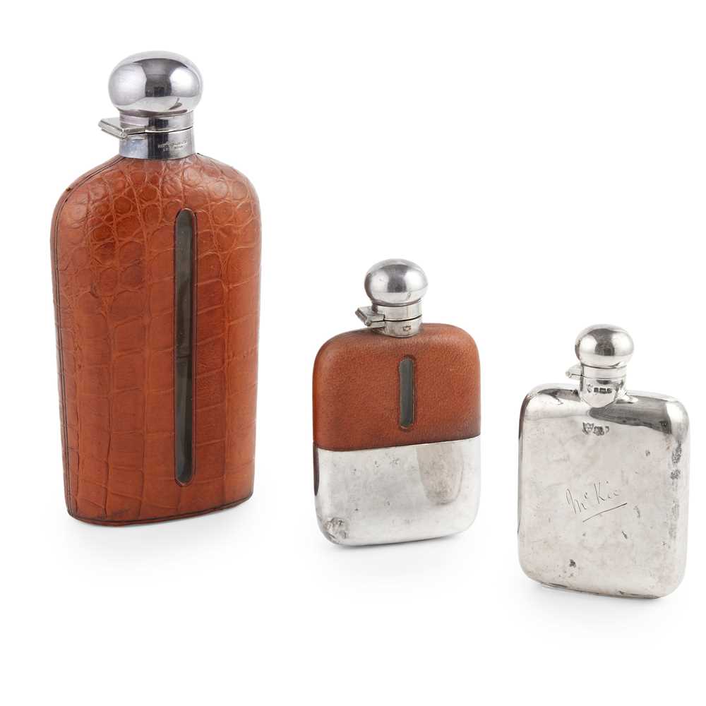 Appraisal: A GROUP OF HIP FLASKS to include G J W