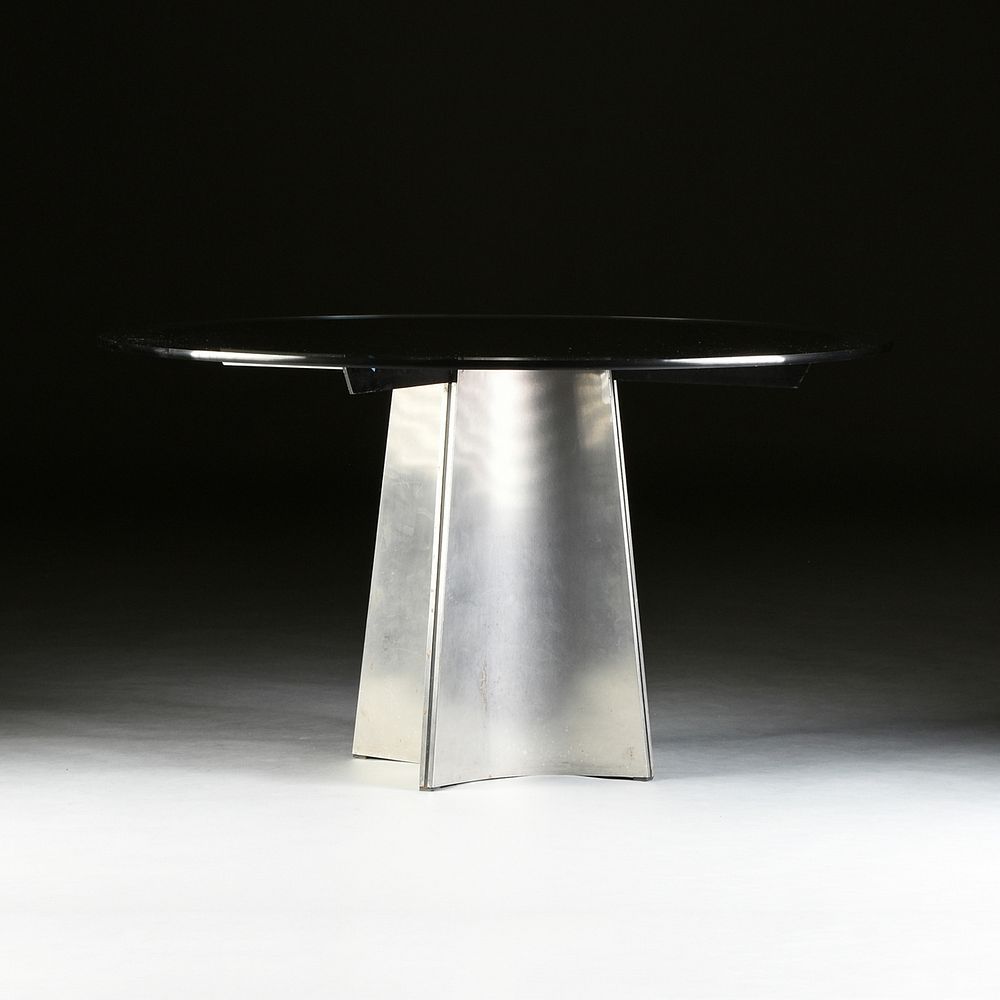 Appraisal: A MAISON JANSEN GLASS AND BRUSHED STEEL BREAKFAST TABLE DESIGNED