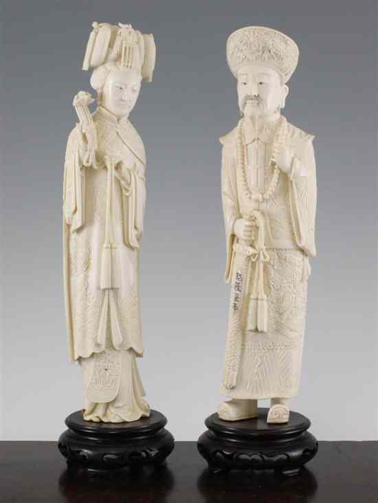 Appraisal: A pair of Chinese ivory standing figures of the Emperor