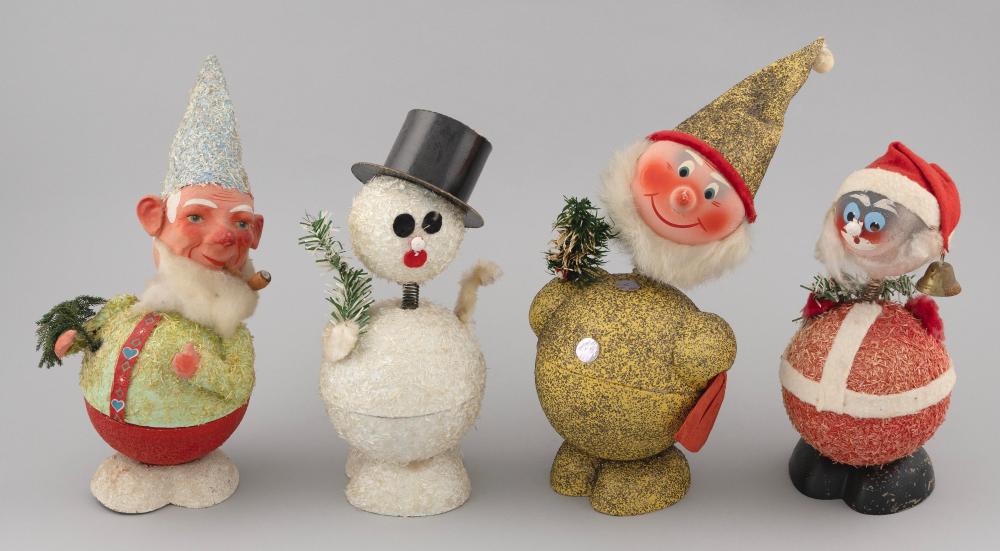 Appraisal: FOUR GERMAN CHRISTMAS CANDY CONTAINERS Mid- th Century In the