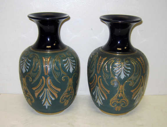 Appraisal: PAIR OF ENGLISH ART POTTERY VASES Baluster bodies with impressed