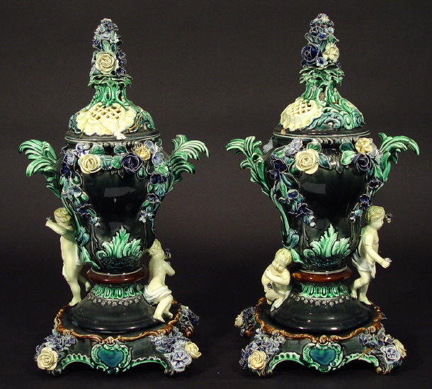 Appraisal: Pair of Rorstrand Majolica vases with floral moulded covers and