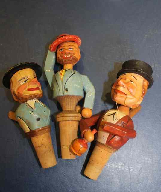 Appraisal: THREE CARVED AUSTRIAN STOPPERS in the form of tavern characters