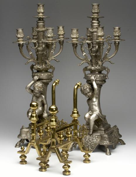 Appraisal: DECORATIVE CANDELABRA Pair of cherub decorated four-arm candelabra together with