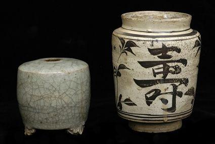 Appraisal: TWO CHINESE POTTERY ARTICLES The larger tzu-chou with -characters spaced