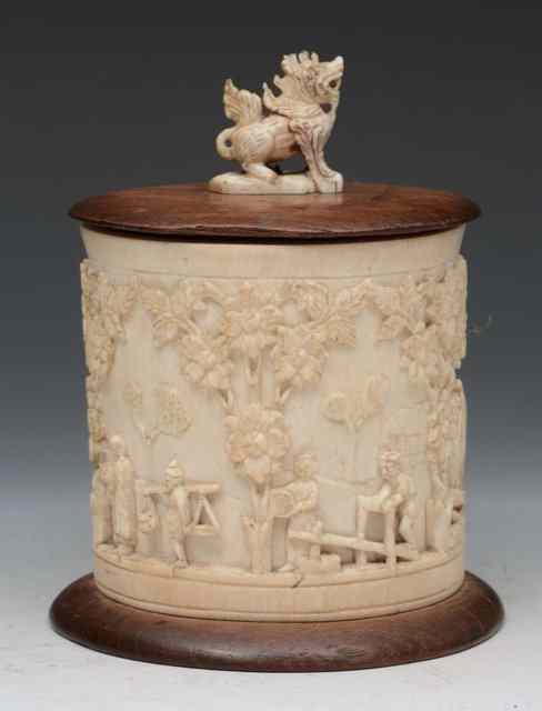 Appraisal: AN INDIAN CARVED IVORY TUSK VASE with wooden cover and