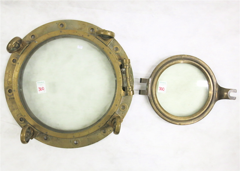 Appraisal: TWO BRASS FRAME SHIPS PORTHOLES the first with outside dimension