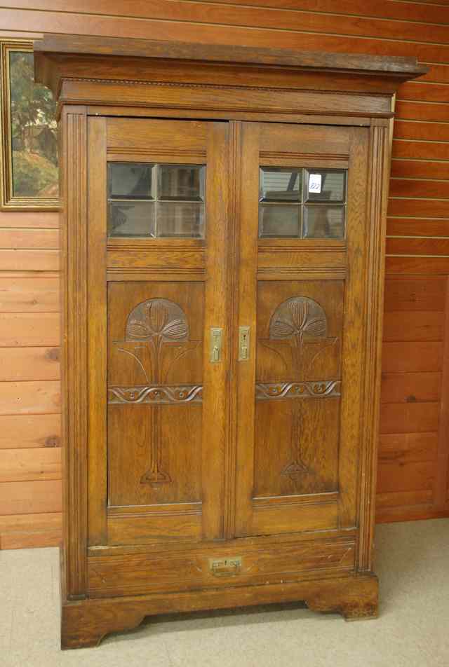 Appraisal: CARVED OAK AND BEVELED GLASS WARDROBE Belgian early th century