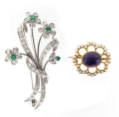 Appraisal: A white gold floral brooch set with diamonds and emeralds