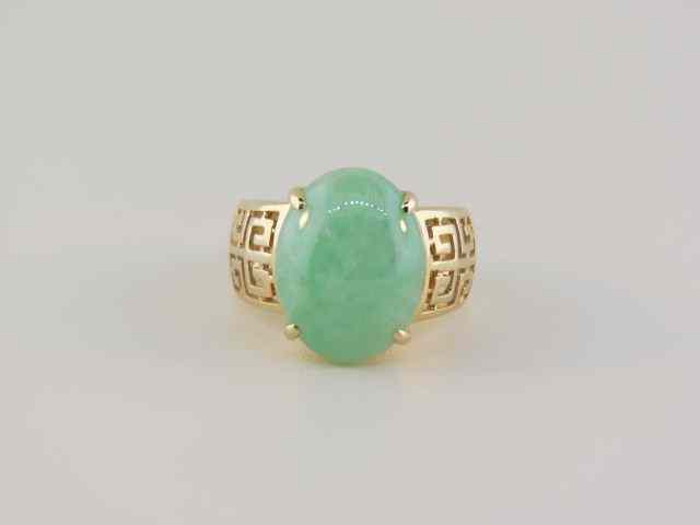 Appraisal: Jade Ring apple green cabachon in fancy openwork setting k