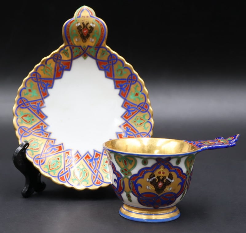 Appraisal: Imperial Russian Porcelain Teacup and Saucer Vibrantly decorated with Imperial