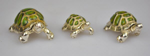 Appraisal: A graduated set of three enamelled silver miniature tortoises