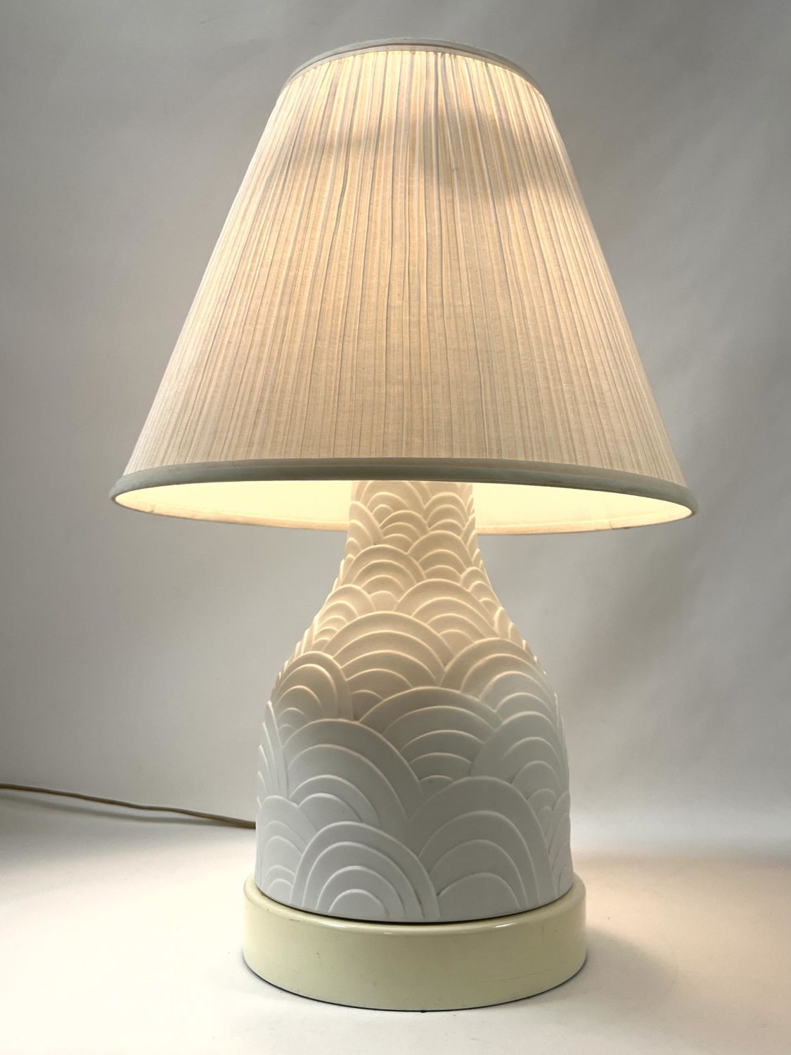 Appraisal: Relief Decorated White Porcelain Table Lamp Pottery only tall Dimensions