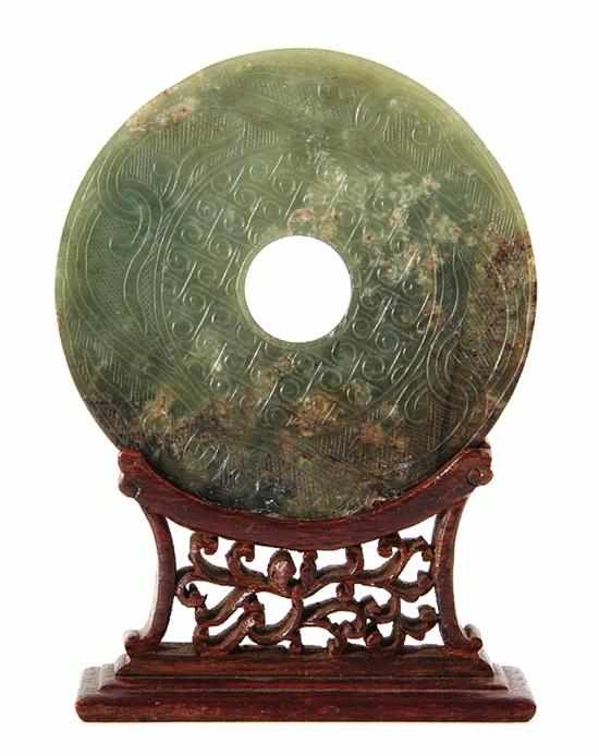 Appraisal: Chinese carved jade disc bi Qing Dynasty vine and lattice