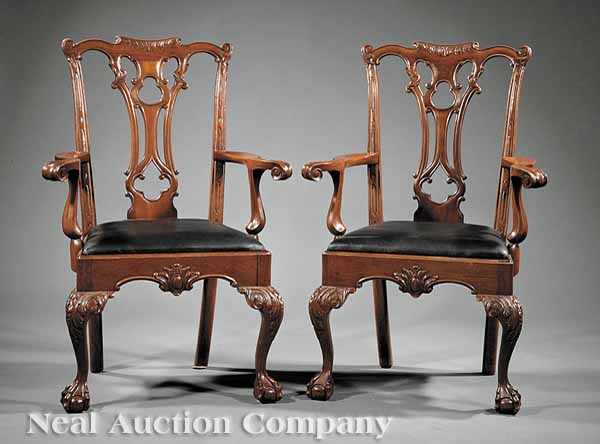 Appraisal: A Pair of Chippendale-Style Carved Mahogany Armchairs each crest with