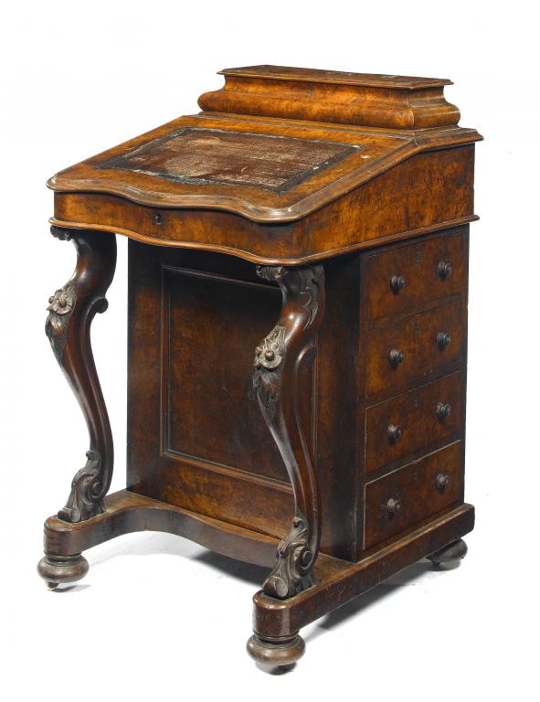 Appraisal: A VICTORIAN WALNUT DAVENPORT surmounted by an ogee stationery compartment