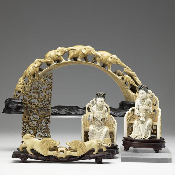 Appraisal: Five carved ivory pieces th C Pair of seated women