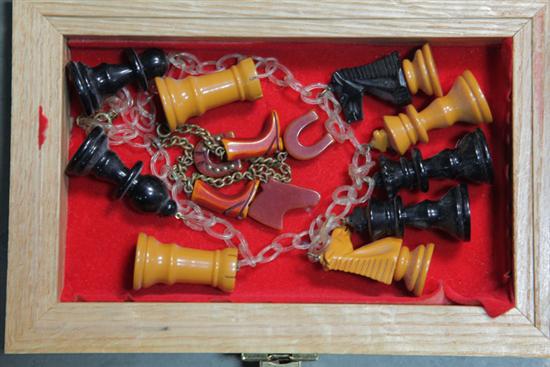 Appraisal: TWO PIECES BAKELITE JEWELRY Celluloid chain with chess pieces ''l