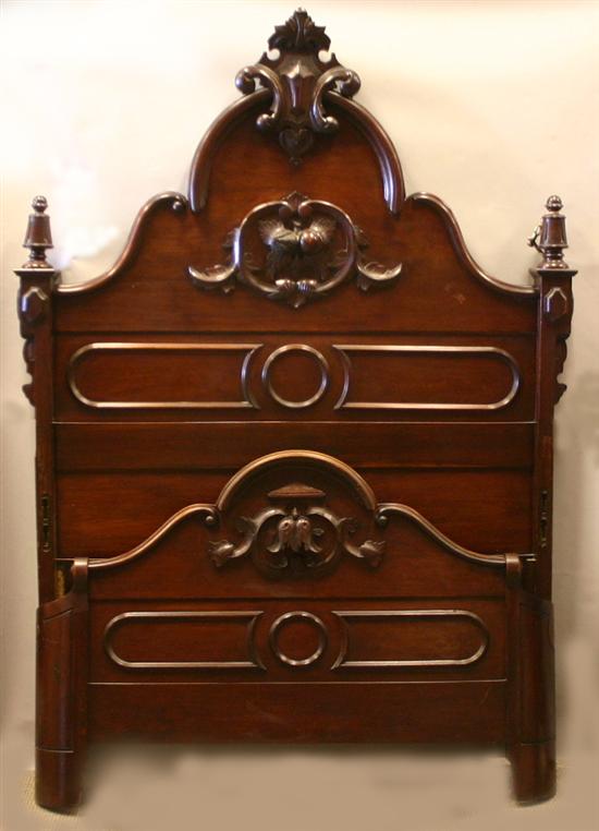 Appraisal: Victorian Renaissance revival walnut bed Headboard with crest having a