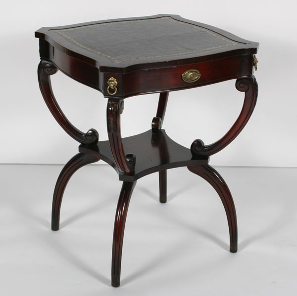 Appraisal: Mahogany lamp table with one drawer shaped leather top brass