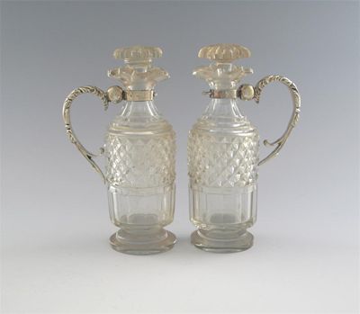 Appraisal: A pair of George IV mounted cut-glass cruet bottles with