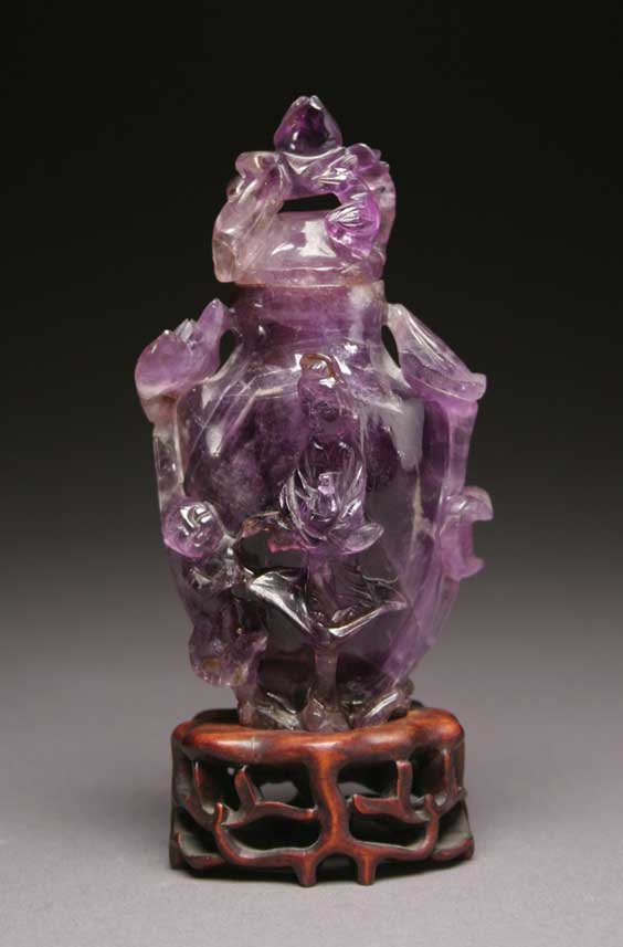 Appraisal: ANTIQUE AMETHYST URN Antique and well carved Chinese amethyst covered