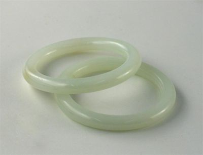 Appraisal: Two Chinese white jade bangles cm