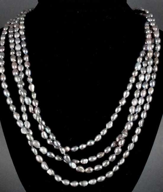 Appraisal: Cultured black baroque pearl necklace approximately in length Estimate -