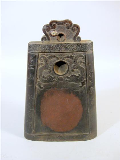 Appraisal: Chinese duan inkstone Qing dynasty Of bell form with scrollwork