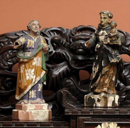 Appraisal: TWO POLYCHROME CARVED WOOD SANTOS FIGURES Each modeled as a