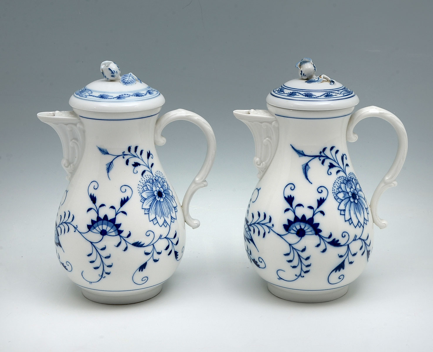 Appraisal: MEISSEN BLUE ONION COFFEE POTS Meissen Blue Onion pattern coffee