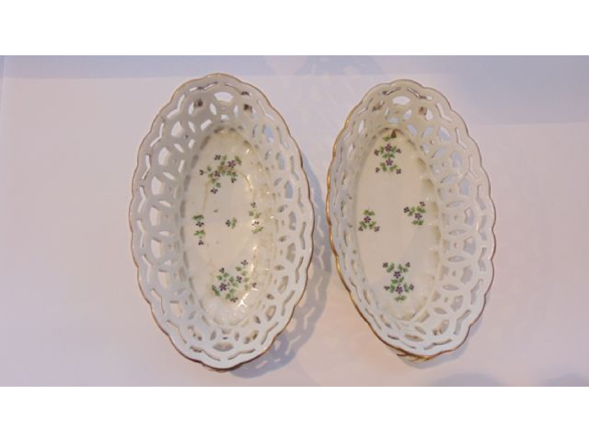 Appraisal: A pair of th century continental baskets of oval form