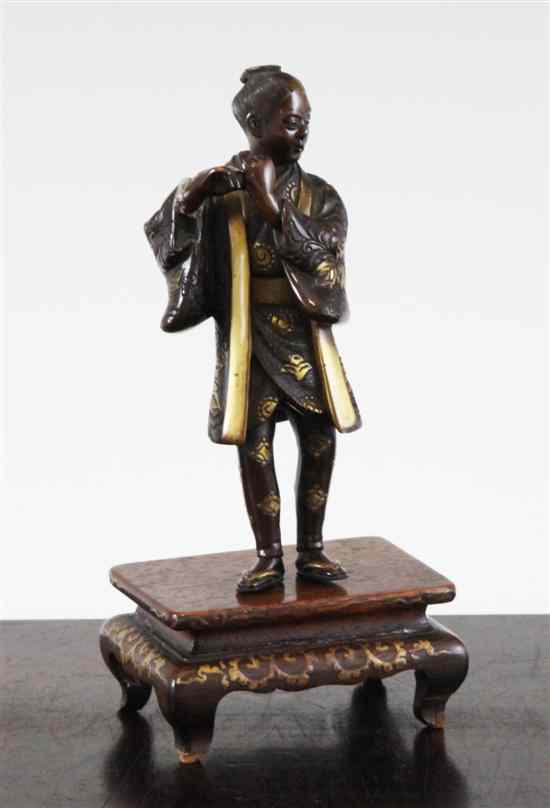 Appraisal: A Japanese Miyao style bronze figure of a flute player