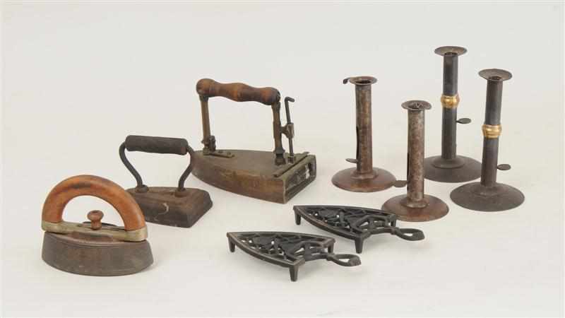 Appraisal: TWO PAIRS OF HOG SCRAPER CANDLESTICKS THREE CLOTHES IRONS AND