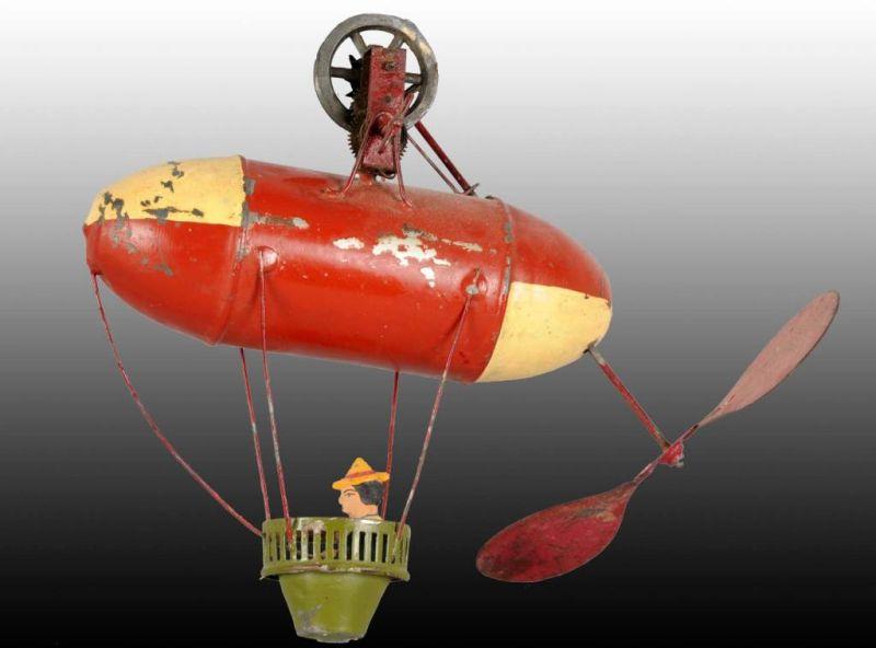 Appraisal: German Tin Santos Hot Air Balloon Toy Description Hand-painted Toy