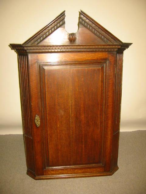 Appraisal: A GEORGE III OAK HANGING CORNER CUPBOARD th century the