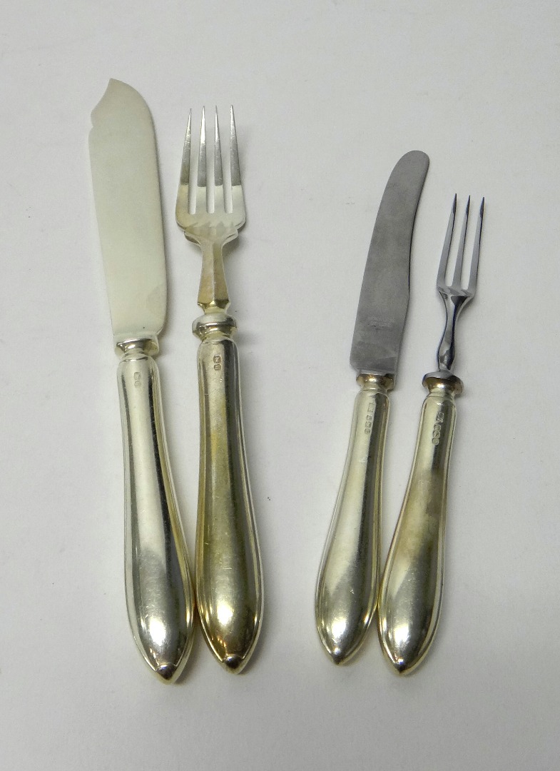 Appraisal: A set of six pairs of silver fish knives and