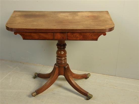 Appraisal: George III mahogany folding tea table on column support and