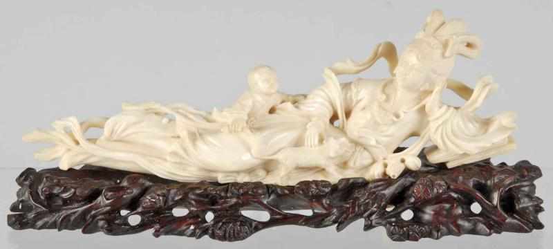 Appraisal: Carved Ivory Woman Description Depicts woman with child and rat