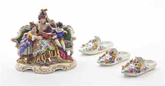 Appraisal: A Dresden Porcelain Figural Group depicting a lady reading to