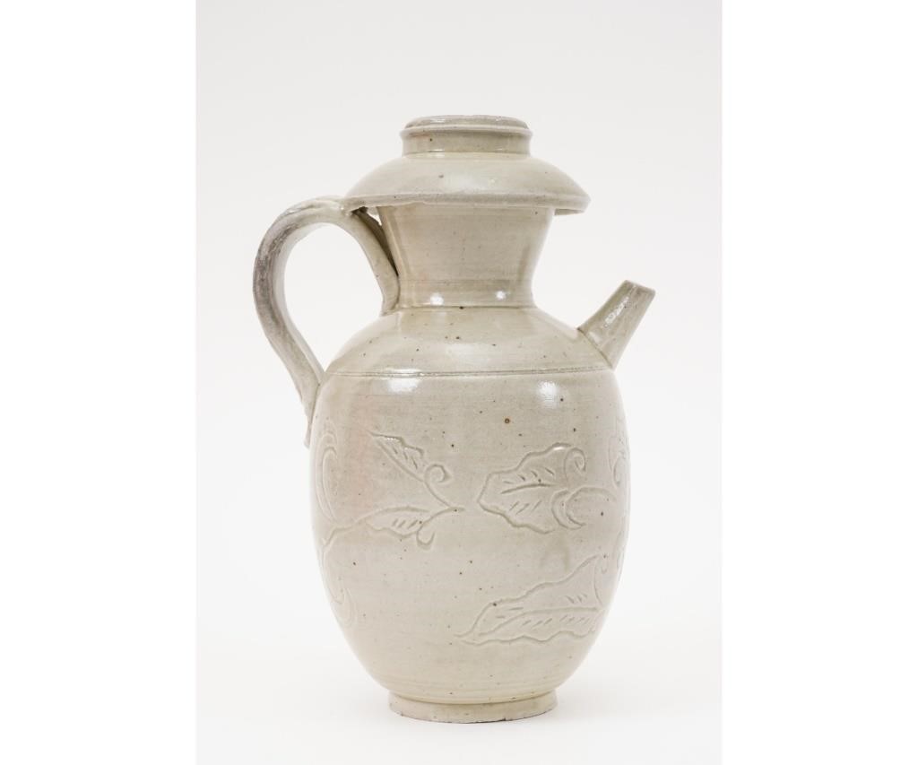 Appraisal: Chinese green glazed ewer with strap handle and incised leaf