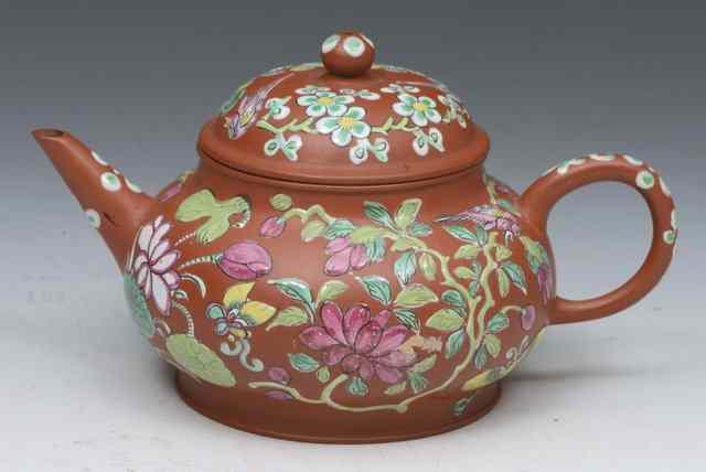 Appraisal: A YIXING CIRCULAR POLYCHROME ENAMEL SMALL TEAPOT decorated with water