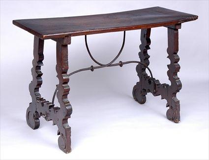 Appraisal: ITALIAN RENAISSANCE-STYLE WALNUT SIDE TABLE The plank top on shaped