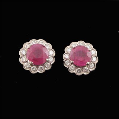 Appraisal: A pair of ruby and diamond cluster ear studs the