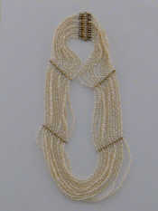 Appraisal: A seed pearl and gold choker necklace the twelve strands