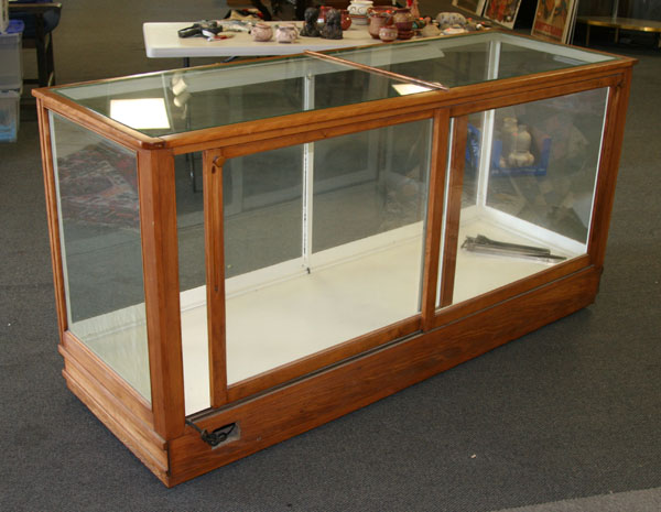 Appraisal: Lighted display case wood frame two shelves glass on all