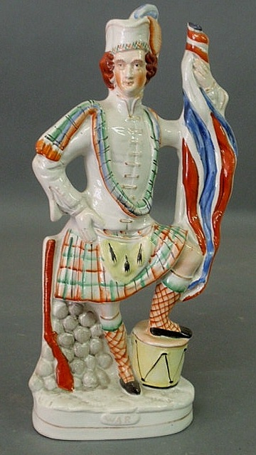 Appraisal: Staffordshire figure of a Scotsman titled War h x w