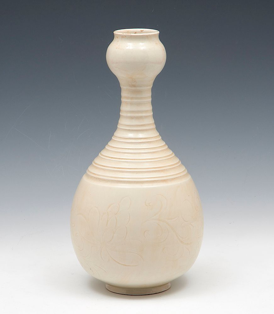 Appraisal: Ding Ware Garlic-Mouth Vase Ding Ware Garlic-Mouth Vase The pear-shaped