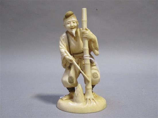 Appraisal: JAPANESE IVORY OKIMONO OF A FARMER th C cutting down